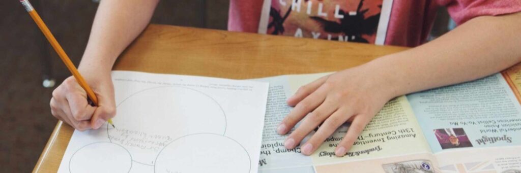 Student writing on graphic organizer