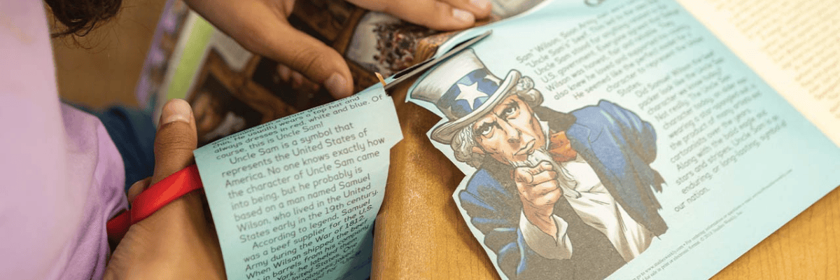 Student using Studies Weekly social studies