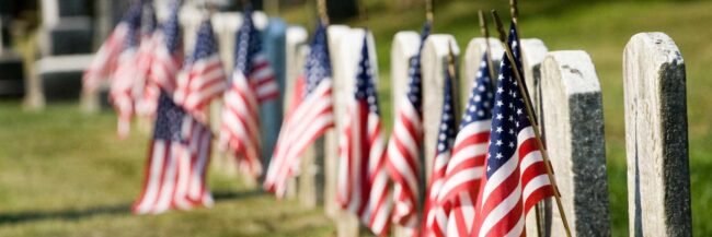 Flags and gravestones to remember fallen soldiers