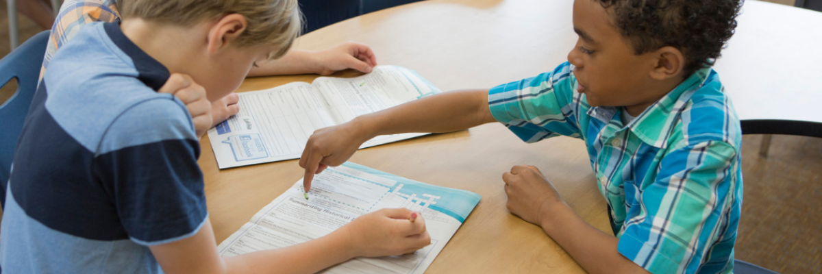 Students reading Studies Weekly Studies Weekly Social Studies