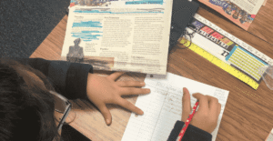 Jen Mello's student works on paper with Studies Weekly