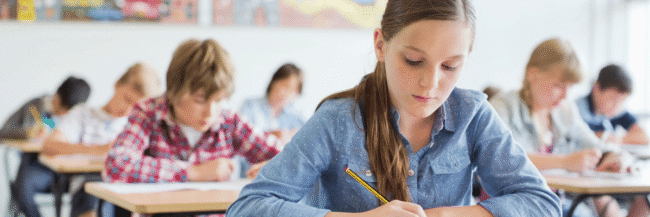 Students-writing-in-class-2 Possible Sentences Vocab Strategy