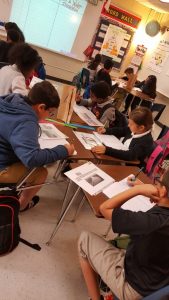 Reginald rights students in classroom