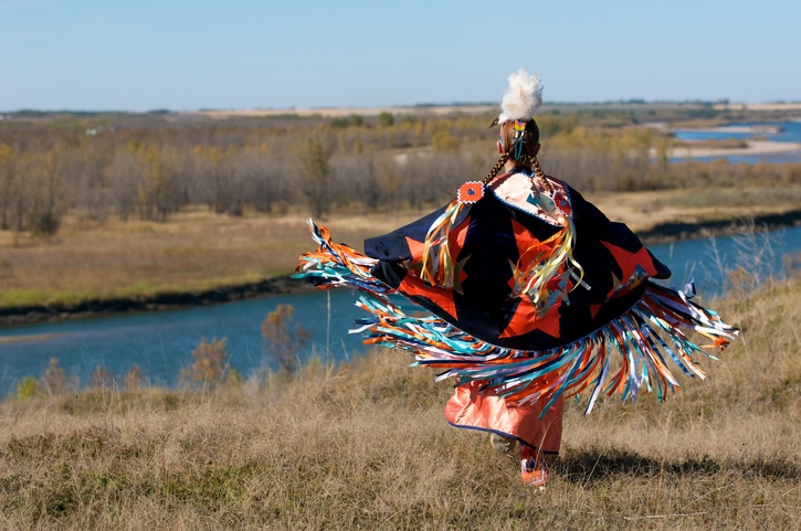 Native American Indian woman dancing, Courtesy of Getty