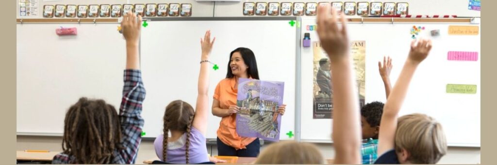 Teacher with Studies Weekly in summer school class.