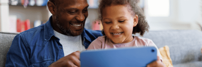 Parent and Child reading on tablet Parent and child reading on a tablet at home together