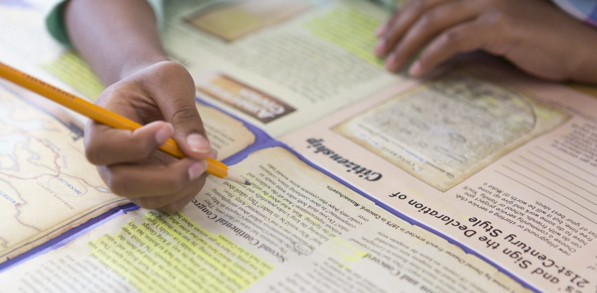 Studies Weekly social studies Studies Weekly newspapers student circling the words on a publication