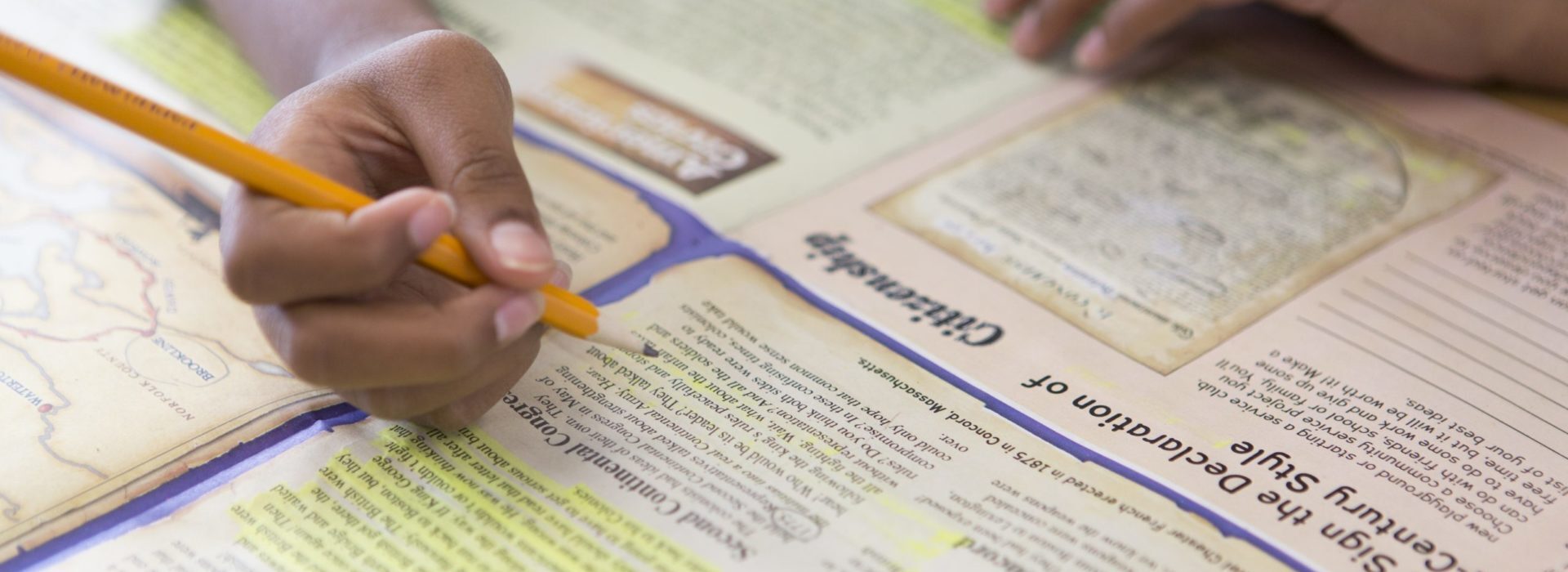 Studies Weekly social studies Studies Weekly newspapers student circling the words on a publication