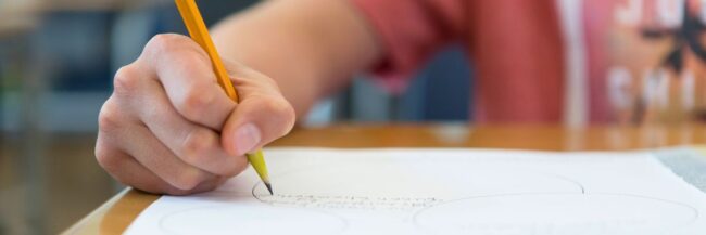 Student writing in Studies Weekly Curriculum and ELA