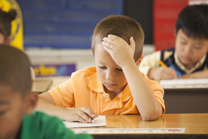 Boy in Class Puzzled Boy stressed in school, needs social-emotional learning