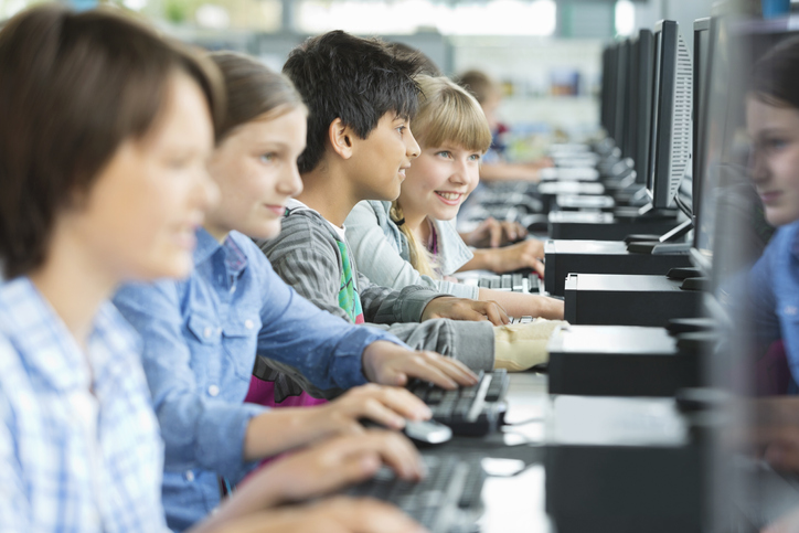 Students using computers in classroom Students following inquiry design model