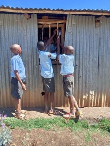 Students in Kenya repair school.