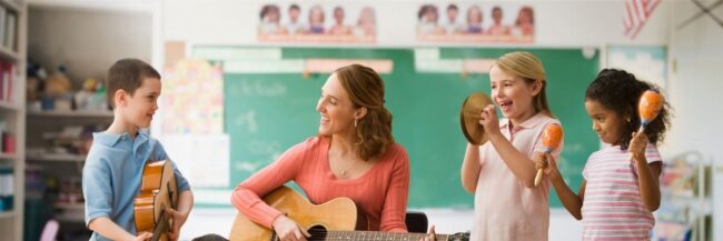 Teacher with students playing music