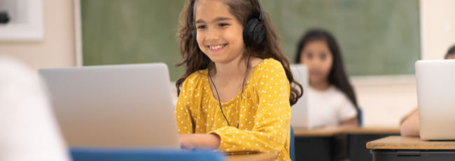 A girl using tech in the classroom