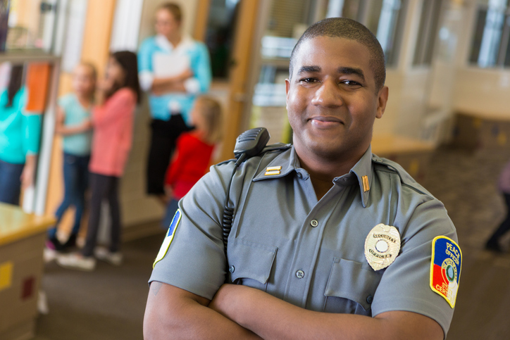 School security guard helping increase student safety and prevent school violence.