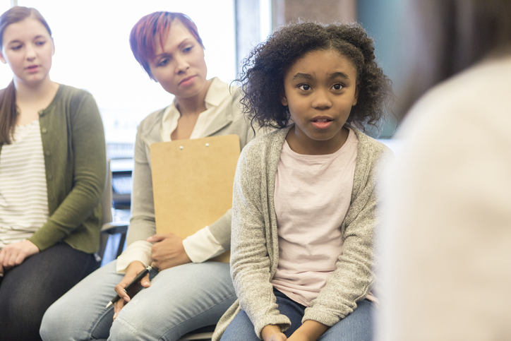 Student talking to school leaders about student behavior
