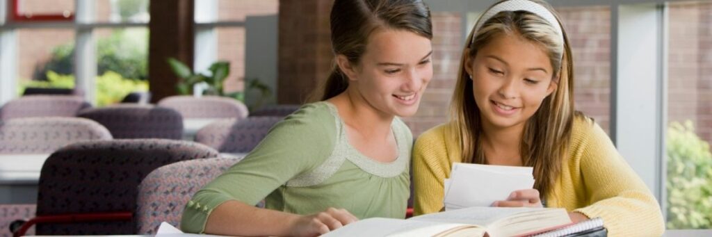 Students-Looking-at-Learning-Materials-September-2025 Students looking at core or supplementary learning materials