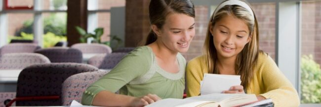 Students-Looking-at-Learning-Materials-September-2025 Students looking at core or supplementary learning materials