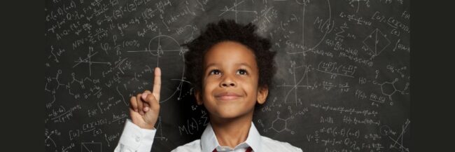 Inquiry-science child standing in front of the science background