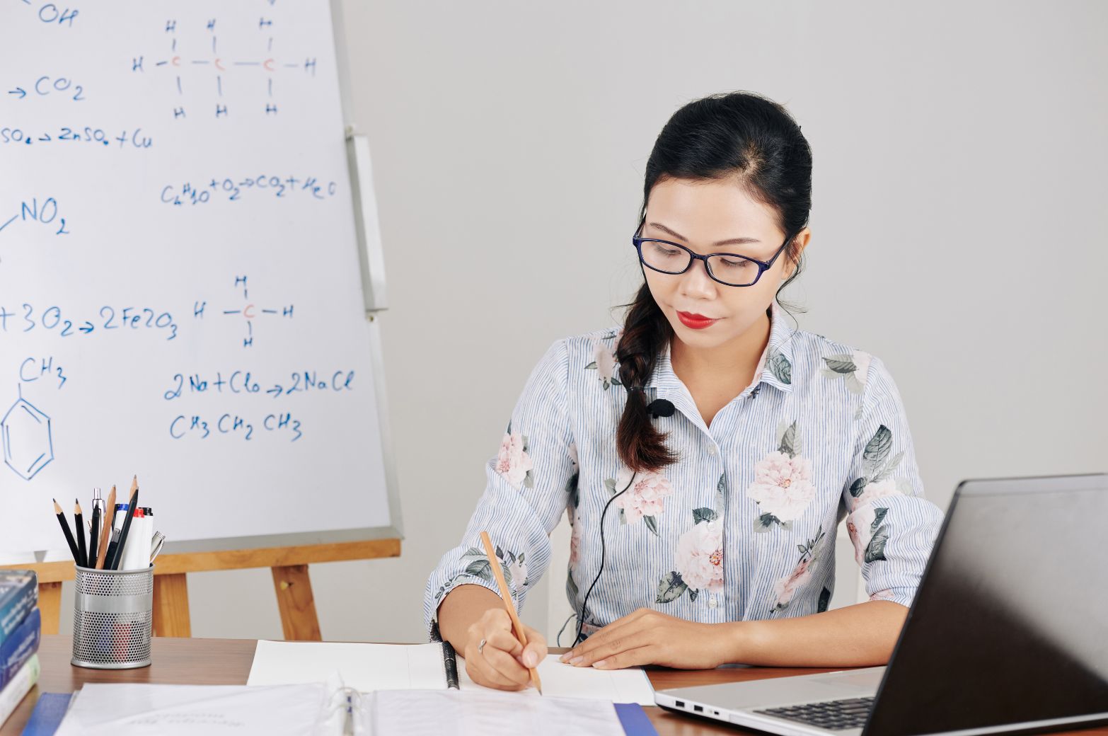 Teacher Planning a Lesson Lesson Planning Strategies - Teaching Sitting at the table writing