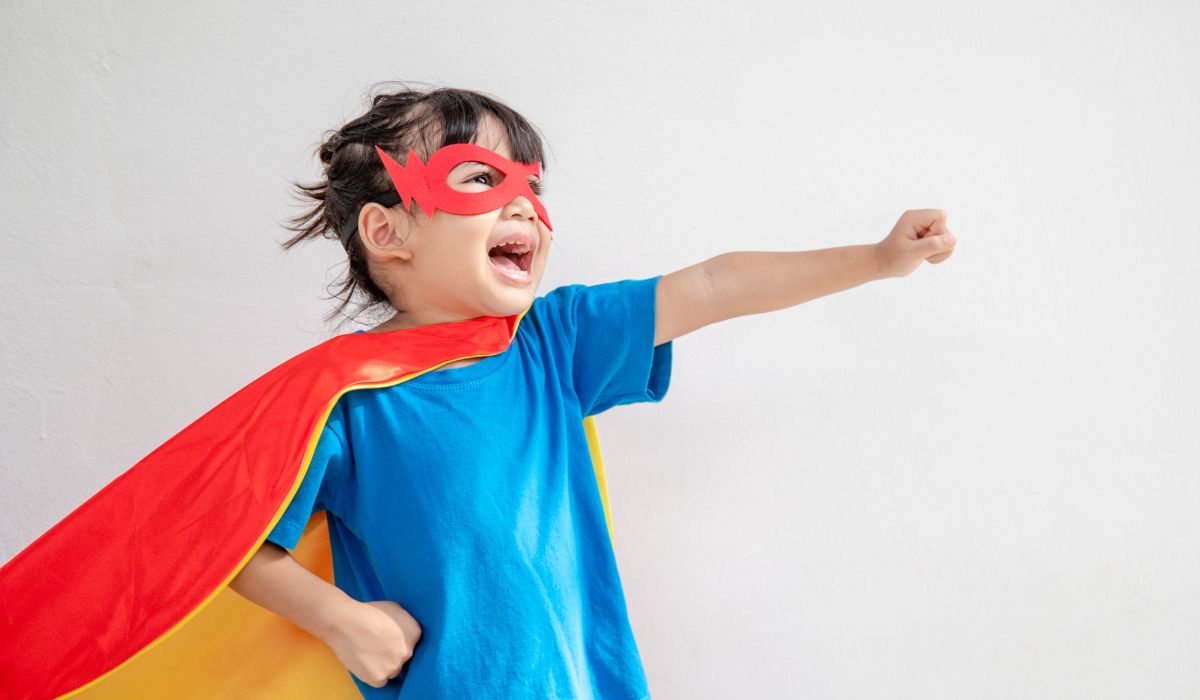 Lifelong Learning Child Dressed Up as a Hero with an Eye Mask and a Cape