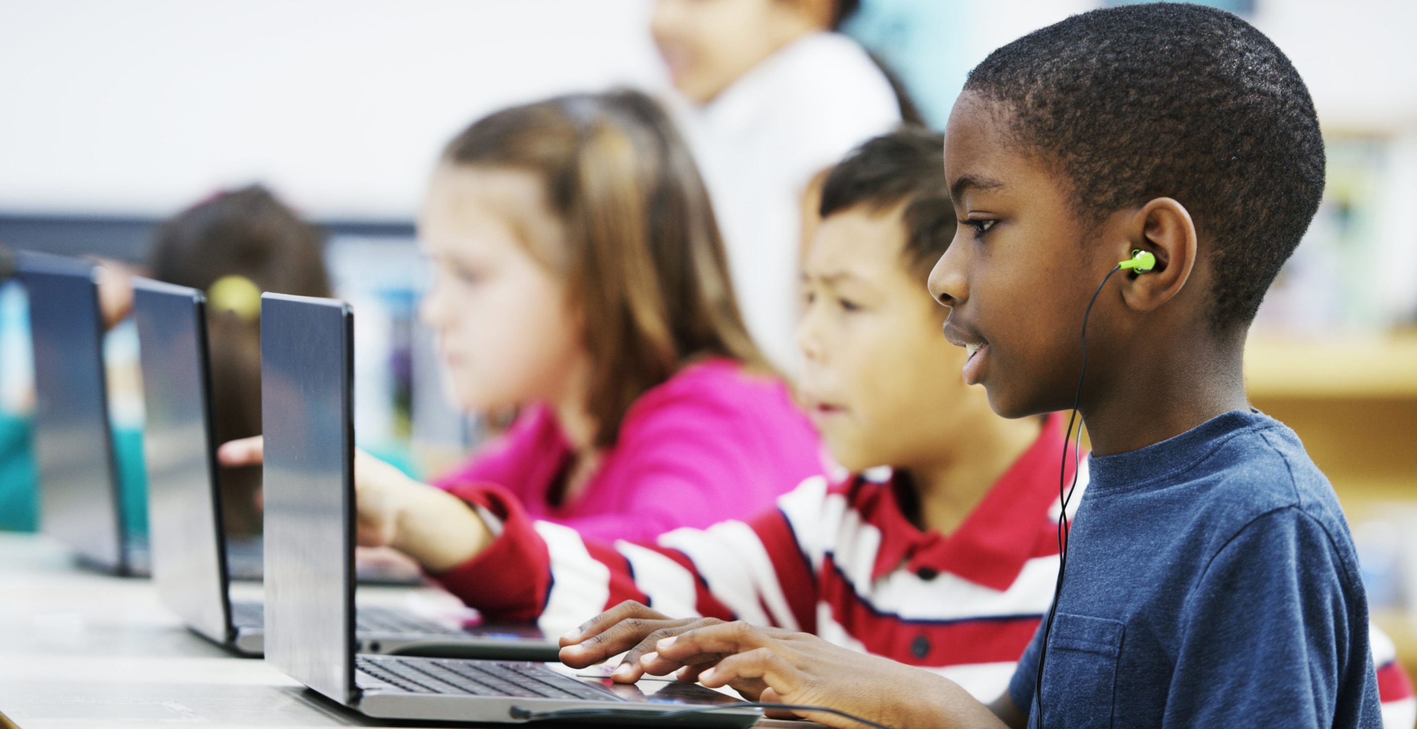 Boys using computers in class