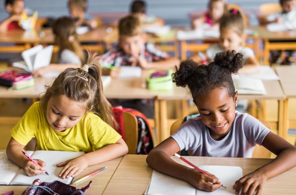 Two girls drawing and testing together