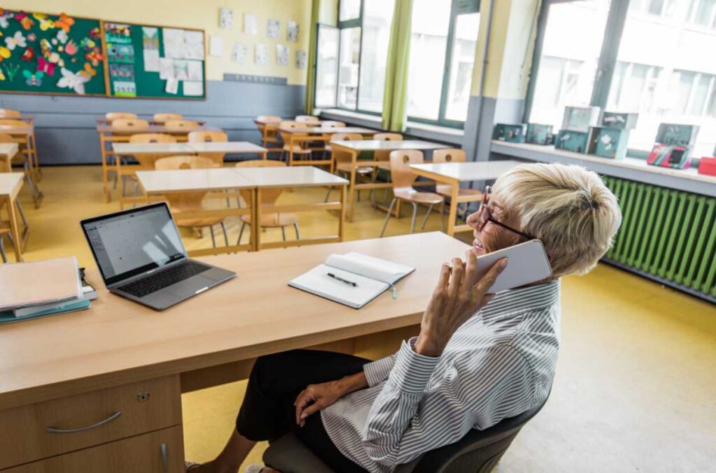 Teacher calling parents to check on a child