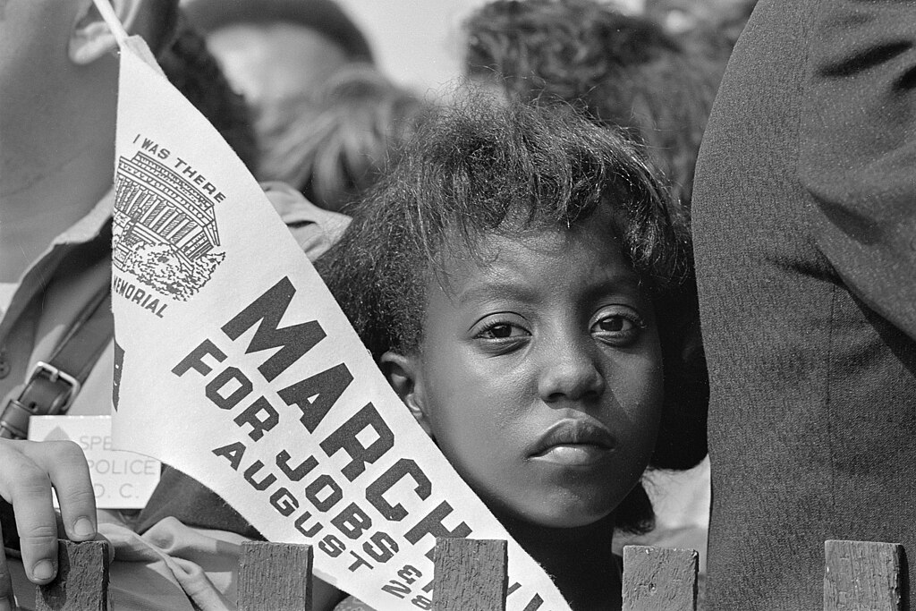 A Young Woman Holds a Banner at the Civil Rights March on Washington D.C on August 28 1963