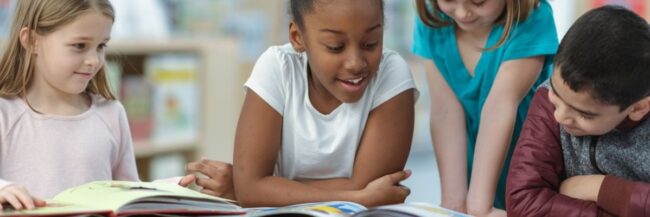 Children reading together and practicing phonological and phonemic awareness