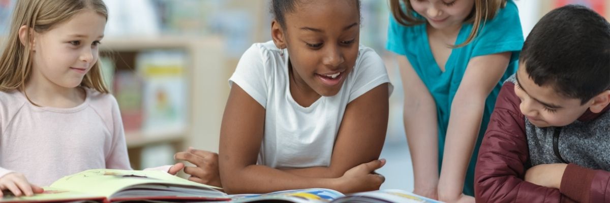Children reading together and practicing phonological and phonemic awareness