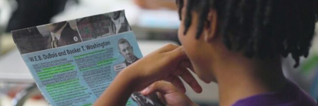 Student reading and annotating Studies Weekly Social Studies