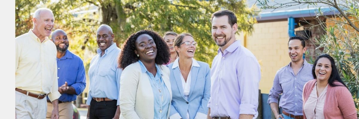 Happy-School-Staff-Laughing Happy school staff together