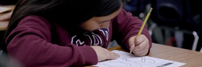 Student writing on a Studies Weekly Health and Wellness printable