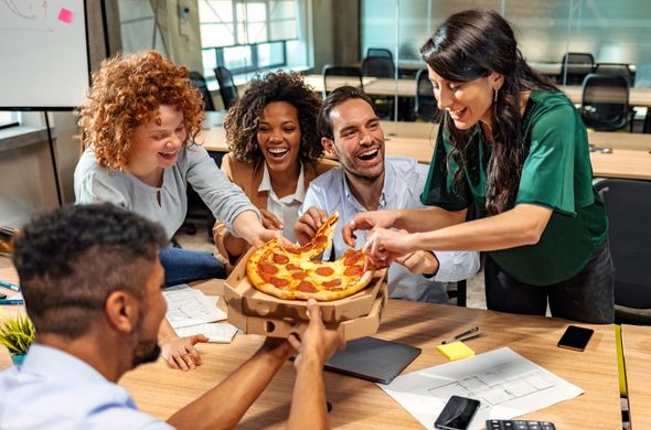 School staff having lunch together to boost their team's morale
