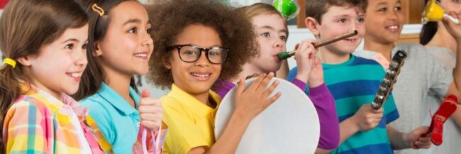 Students playing instruments to learn social studies and music together.