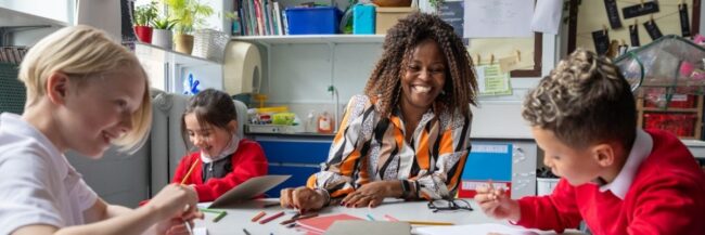 Happy Teacher – October 2025 Happy teacher with students