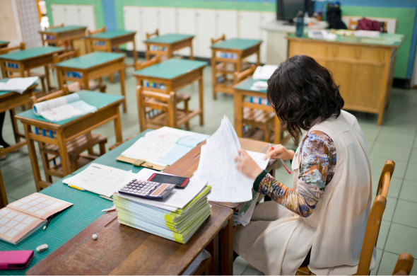 Prepared teacher New teacher preparing materials for the day