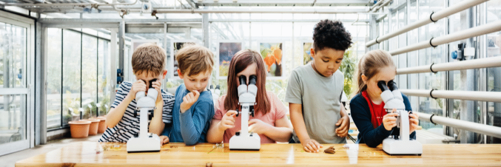 Student Scientists Students with microscopes learning science
