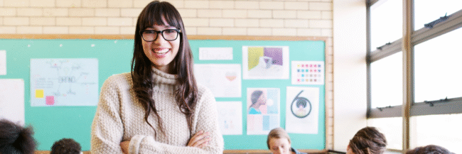 New teacher smiling in front of class