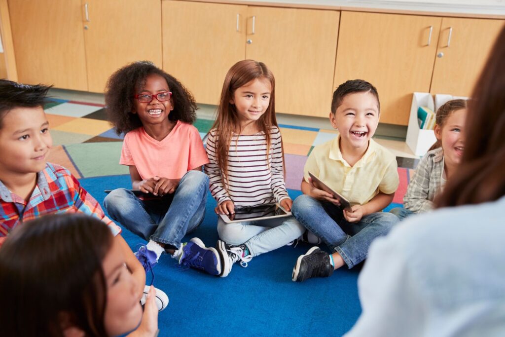 Students sitting in a circle reflecting on the year