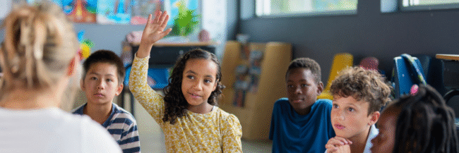 Inquiry-Learning-2 Students raising hands as they learn through inquiry