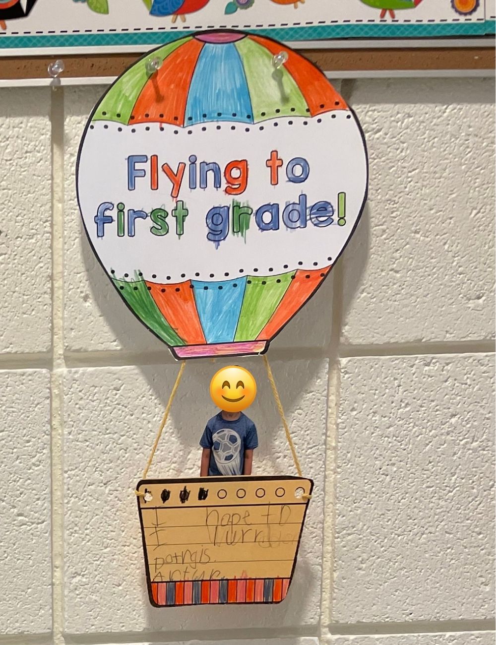 Paper hot air balloon art project with a short write up about what students are looking forward to in first grade