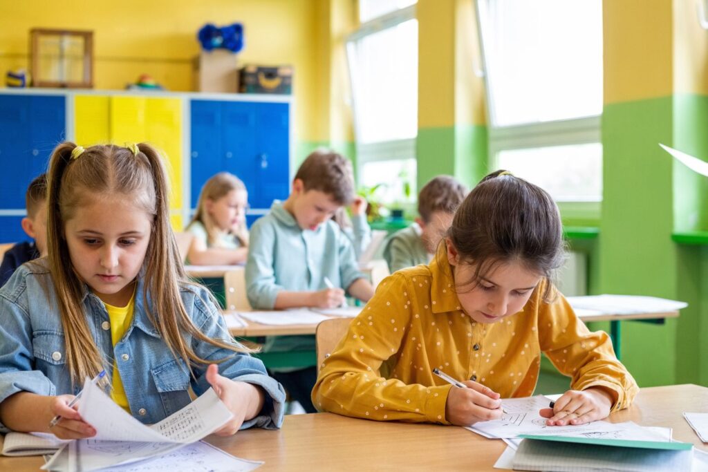 Students working at desks Students sitting at desks working quietly