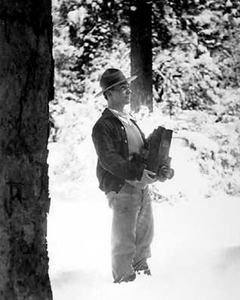 George Meléndez Wright, Hispanic biologist, standing outdoors observing nature