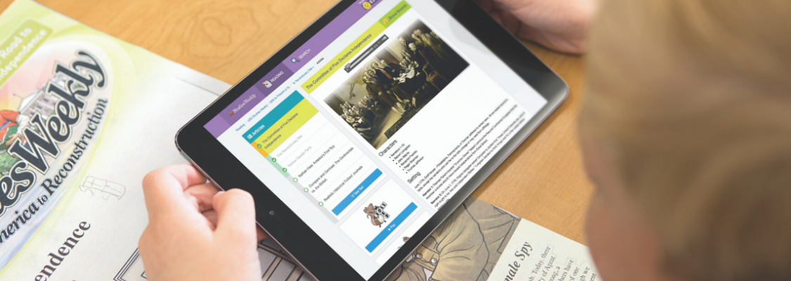 Studies Weekly Online Updates Student with ipad and Studies Weekly Online