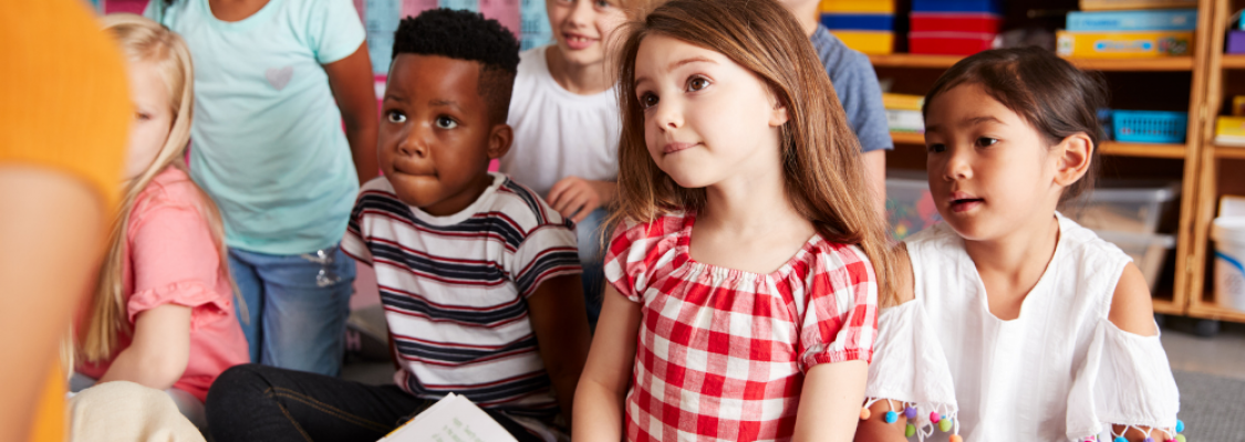 Teacher reading to students. Teacher reading to students.