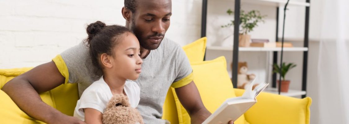 Father reading to his daughter Parent involvement
